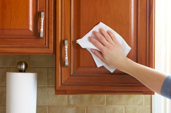 Cleaning kitchen cabinets and drawers inside and out is the first step to organizing and staging