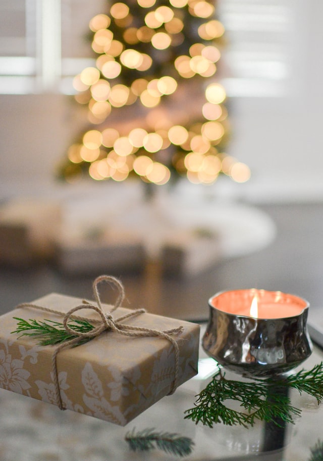 Decorate the foyer with a few simple elements; books, candle, present, a small tree.