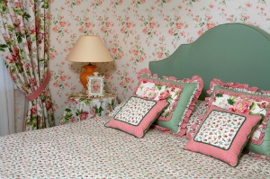 This outdated bedroom decor with the old wallpaper will not help sell your home.