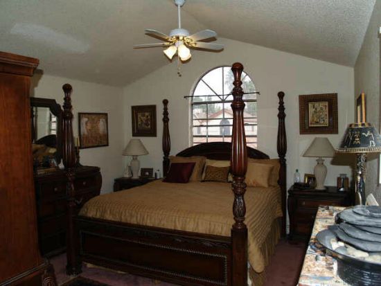 Too much furniture makes this bedroom appear cramped.