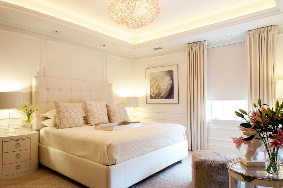 A beautifully stage bedroom in a monotone color scheme.