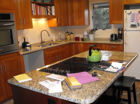 Unfinished and cluttered kitchen.