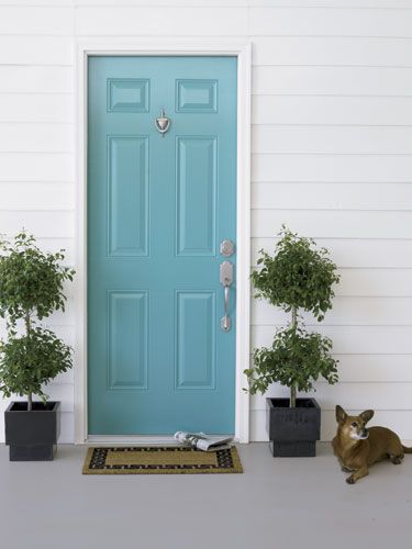 Flank the front door with potted plants.