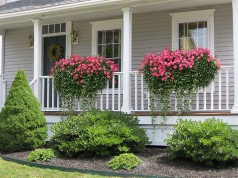 Add porch railing flower boxes to your front entry for greater curb appeal.