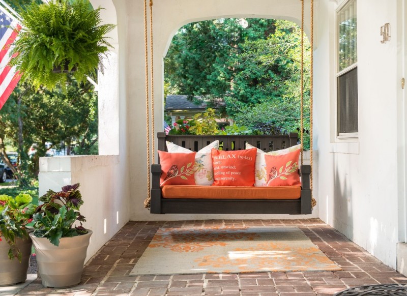 Place a porch swing at the front of the house to increase curb appeal.