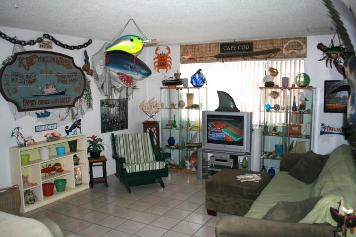 Living room with a crowded, overdone underwater theme.