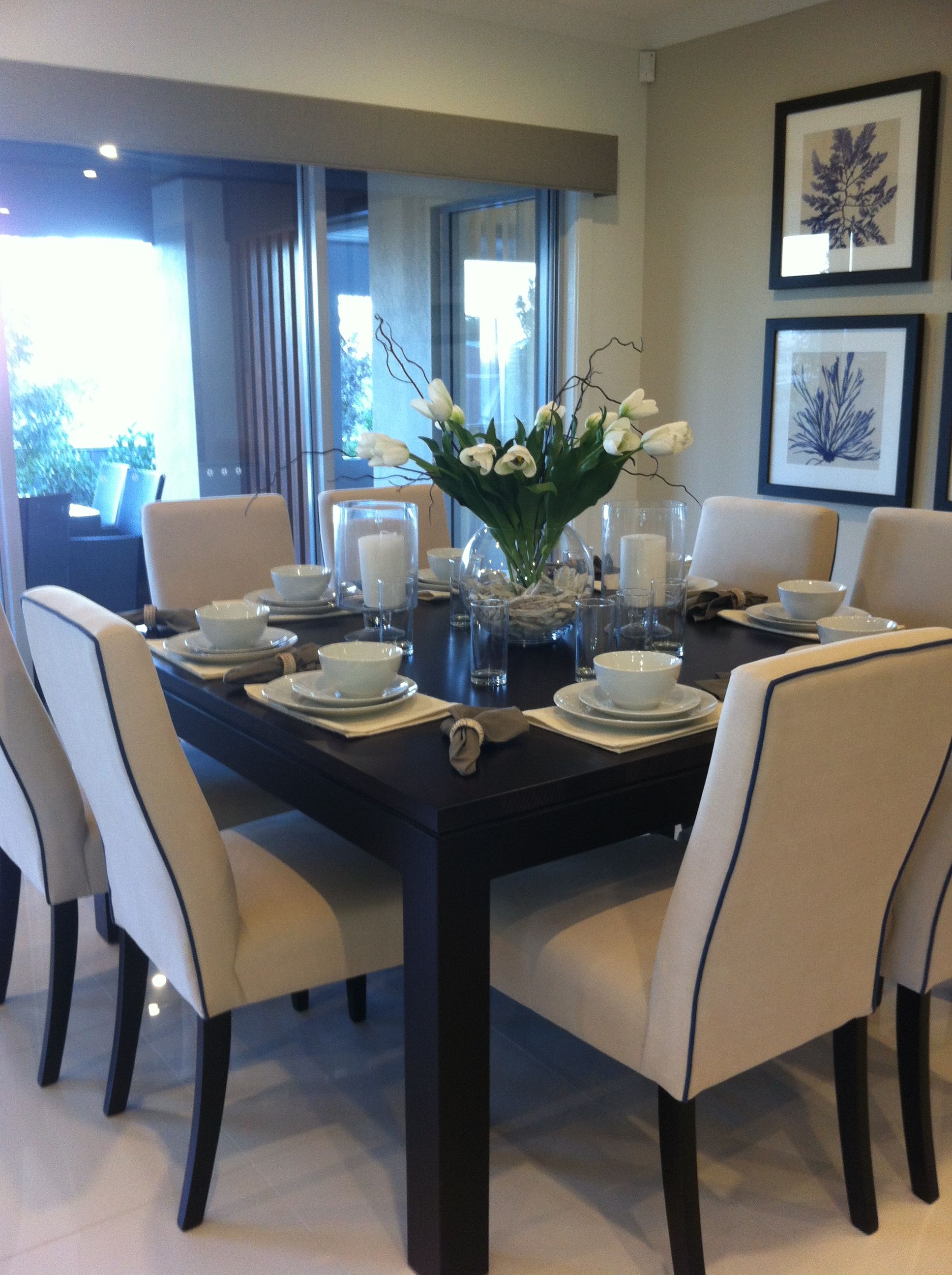 Beautifully staged dining table set with dining ware.