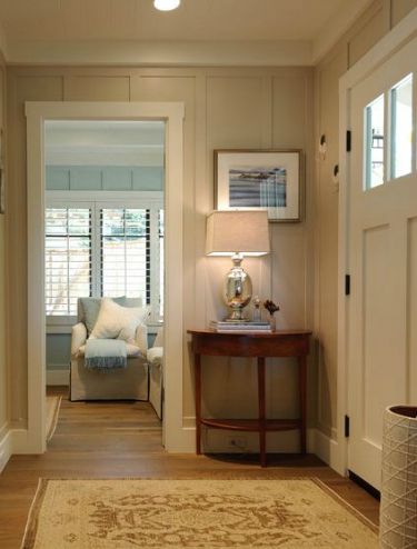 Small entryway painted in light, neutral colors.