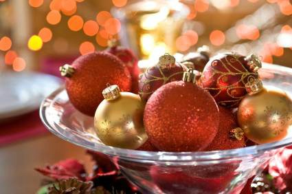 Glass Christmas ornaments in a glass bowl.