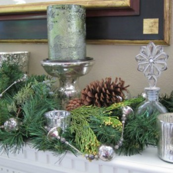 Use neutral colors like white, silver and gold. Combine with natural elements like pinecones and cedar boughs.