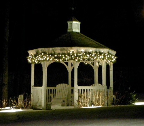 Highlight outdoor features, like a gazebo, with Christmas lights.