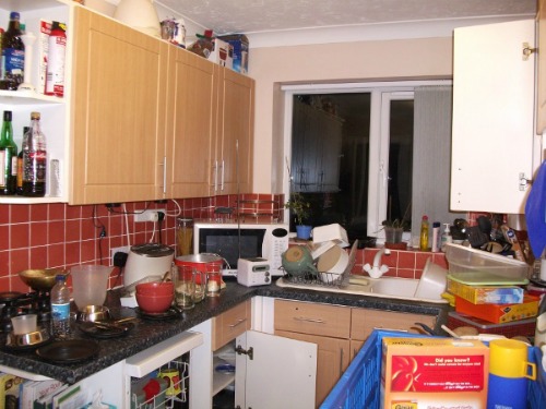 Extremely cluttered kitchen.