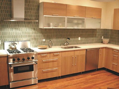 Kitchen with pretty green tile backsplash.