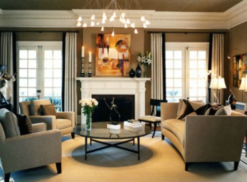 Symmetrical room with fireplace and round coffee table.