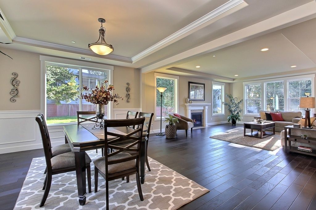 Paint colors unify this open concept living room and dining room.