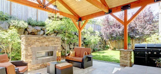 This outdoor entertainment area has it all! A fireplace, barbecue and sitting area.