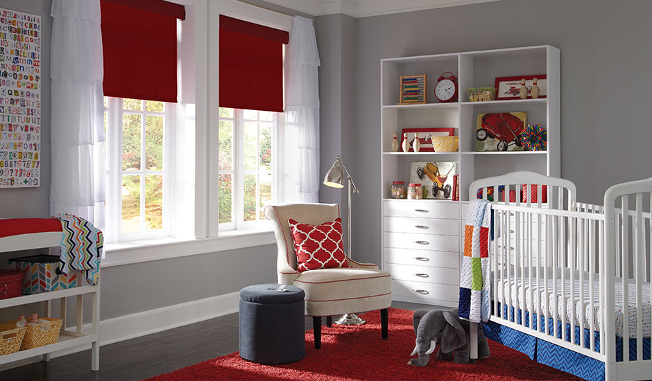Baby's room with red window shades and blinds