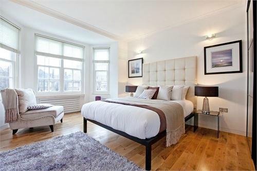 Bedroom with an open legged frame bed.