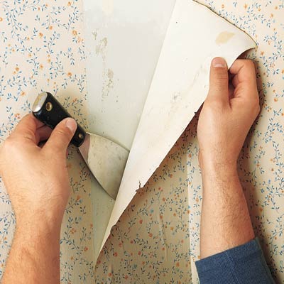 Stripping wallpaper.