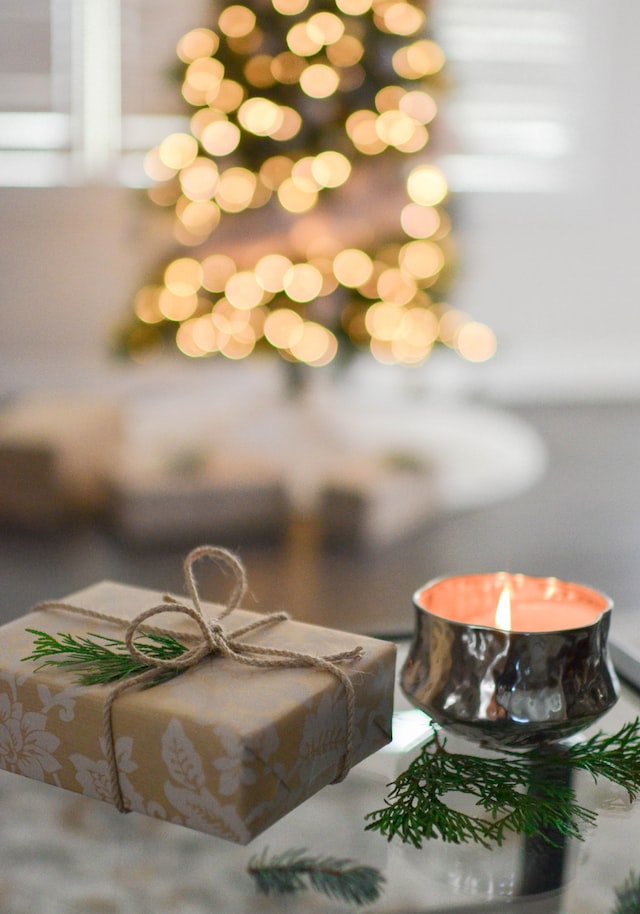 Decorate the foyer with a few simple elements; books, candle, present, a small tree.