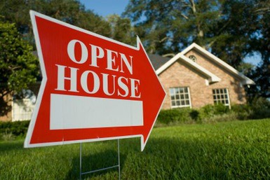 Open house sign with an arrow.