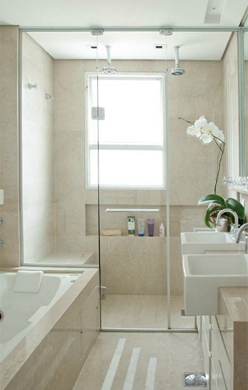 Glass shower doors can visibly expand the space in a small bathroom.