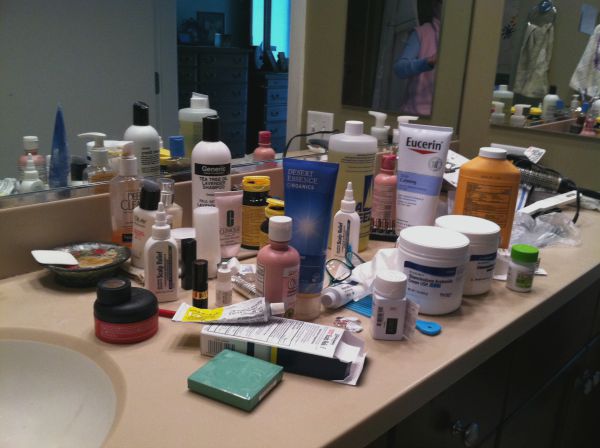 This cluttered bathroom counter shows buyers that there is no storage room.