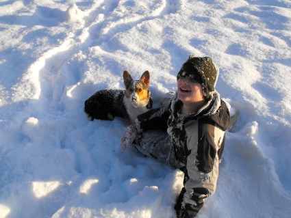 Son and Corgi in the Snow