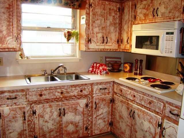 Sponge painted kitchen cabinets are very taste specific.