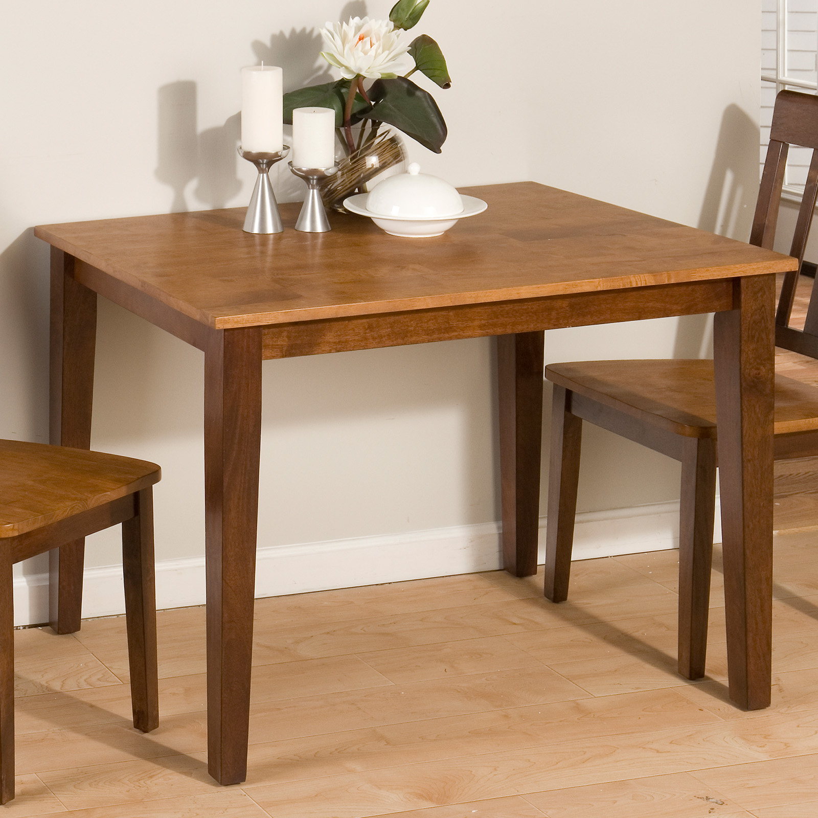 For an extra small dining area, remove most of the chairs and place an uncomplicated arrangement on the table.