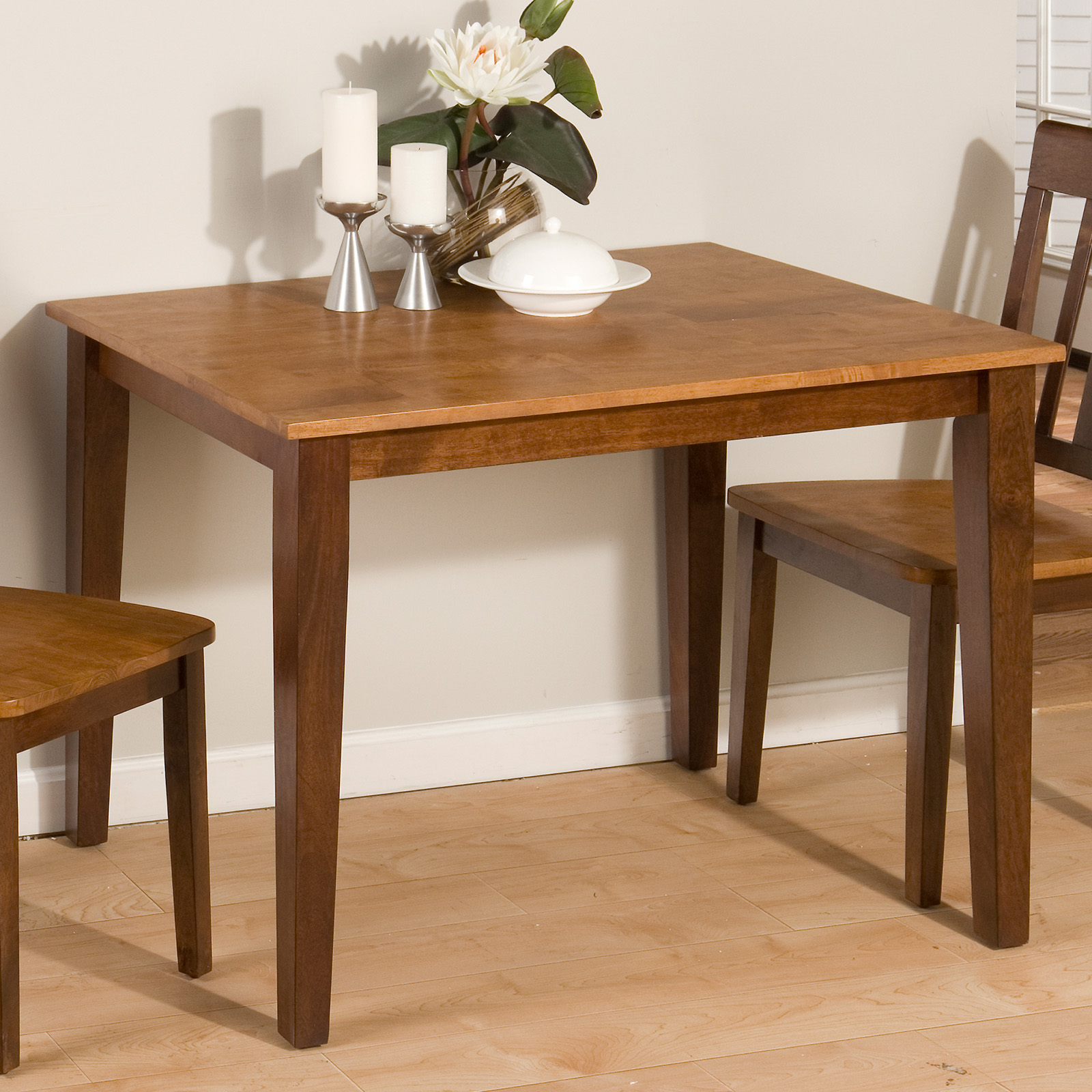 Small kitchen table with two chairs.