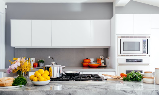 Remodeled kitchen with marble countertop.