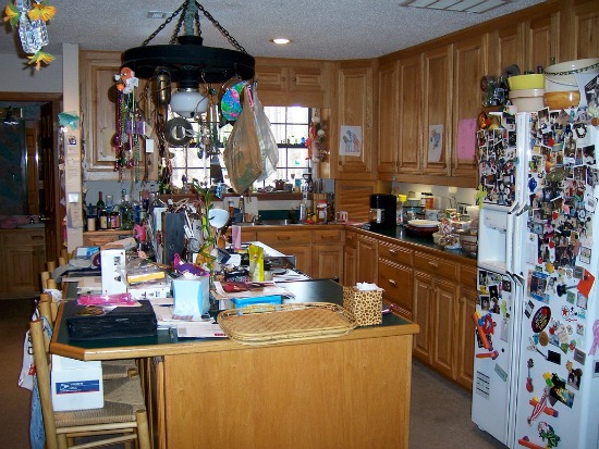 An extremely cluttered kitchen.