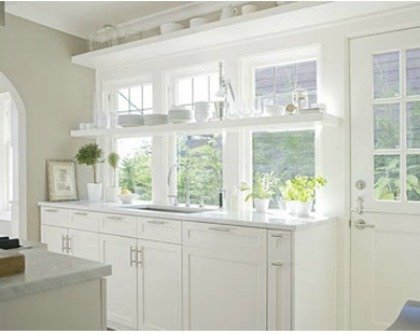 This monotone color scheme makes this small kitchen feel larger.