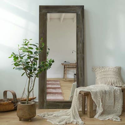 This leaning floor mirror brings added dimension to the room.