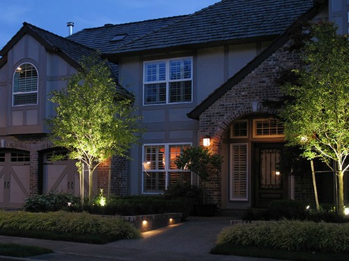 Home exterior picture with night lighting.