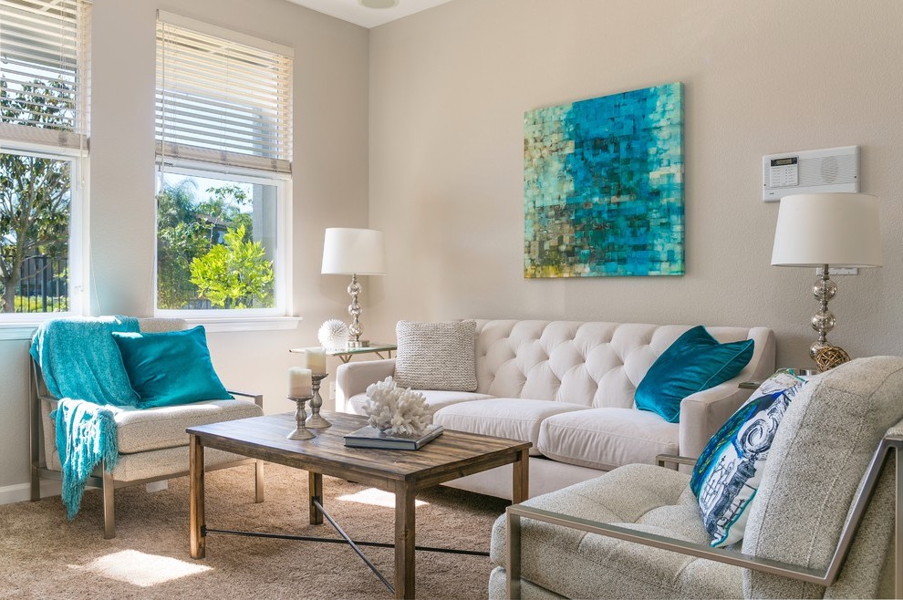 Neutral living room with blue accent colors.