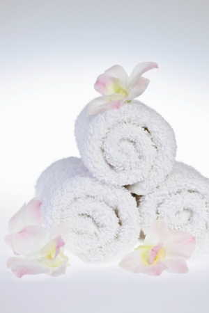 Rolled bathroom towels create a sense of luxury.