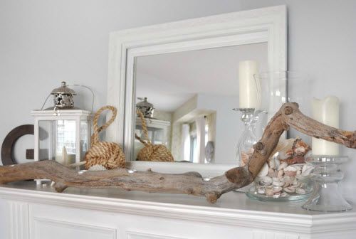 Beach-themed vignette on a fireplace mantle.