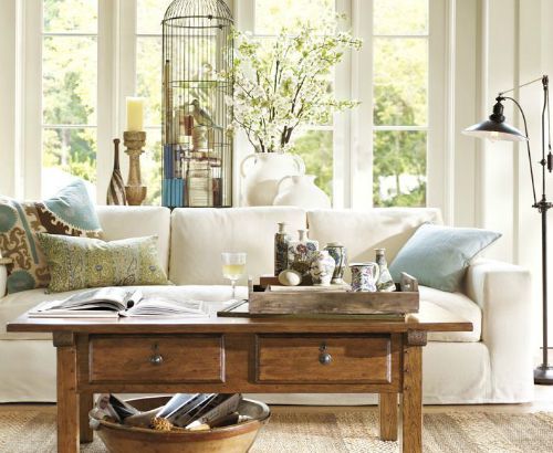 Living room with stunning vignettes. Photo by Pottery Barn.