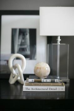 A stack of books is a great way to elevate an object in a vignette.