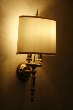 Wall sconce lighting provides a subtle light and serves as a decorative feature in a home.